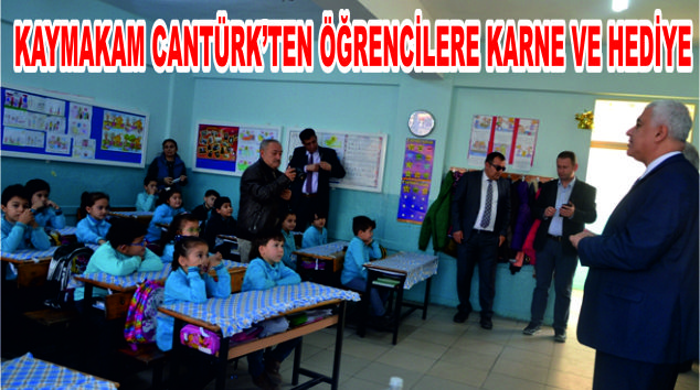 Kaymakam Cantürk’ten öğrencilere karne ve hediye